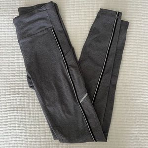 Lululemon leggings. Size 4. Gray with silver stripes down legs.